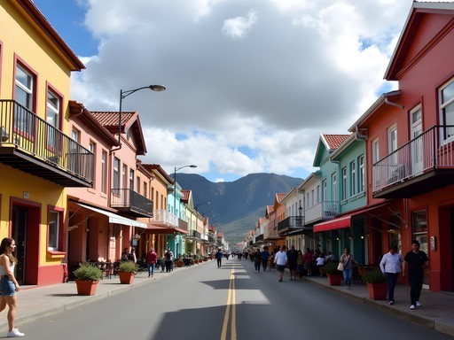 Colorful buildings along Ushuaia's main street with mountains in background