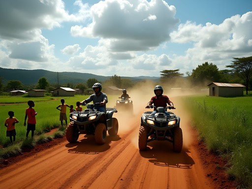 Quad biking through rural villages and red dirt roads near Jinja, Uganda