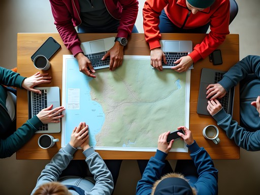 Group of adventurers gathered around table with maps, laptops, and coffee mugs planning daily activities