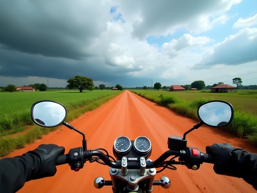 Motorcycle on rural Paraguayan road with red soil and lush vegetation