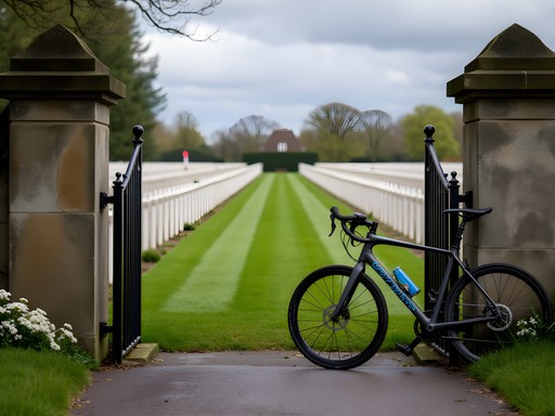 Bicycle leaning against fence with Tyne Cot Cemetery visible in background