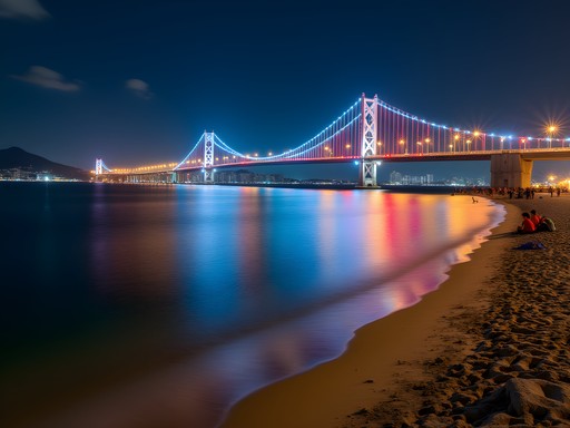 Gwangan Bridge illuminated at night over Gwangalli Beach with city lights reflecting on water