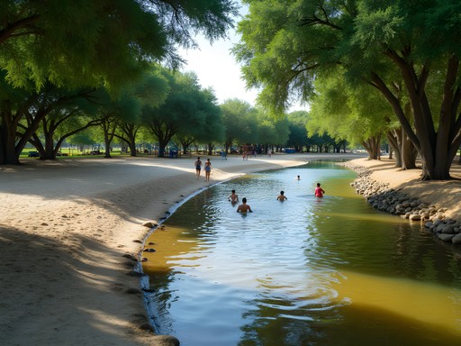 Peaceful creek beach area at Father McNaboe Park with families enjoying the water