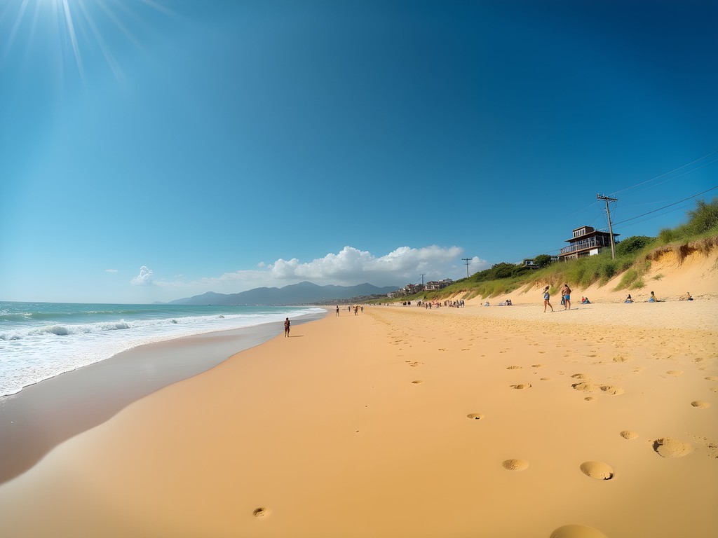 Wide sandy beach of Praia da Reserva with protected natural vegetation and dunes