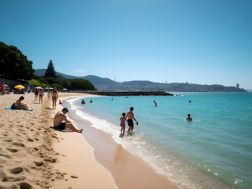 Oriental Bay beach in Wellington with families enjoying summer activities and city skyline