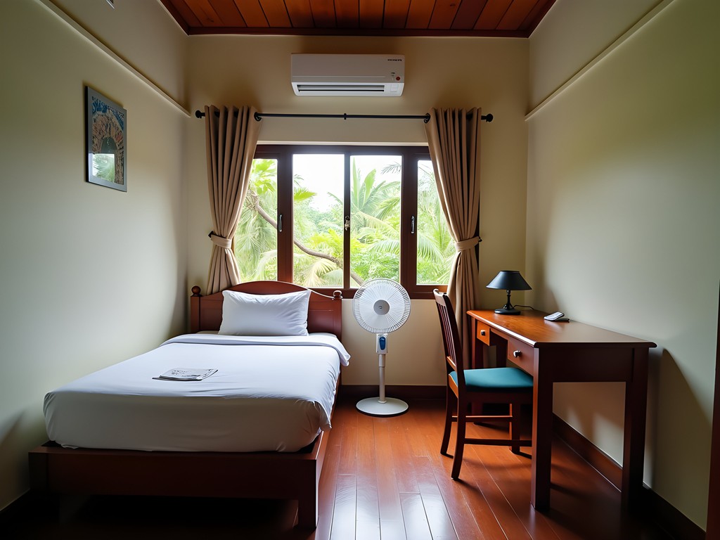 Simple but clean fan room at Nang Noi Guesthouse in Pakse, Laos