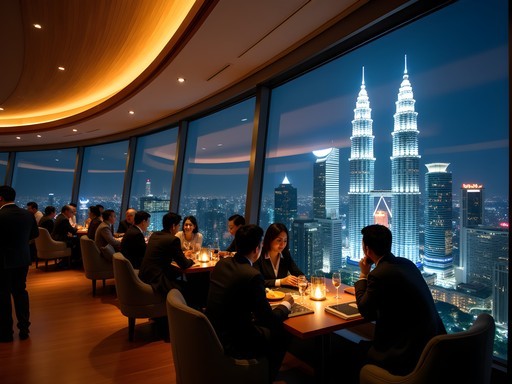 Elegant rooftop bar in Kuala Lumpur with dramatic night view of illuminated Petronas Towers