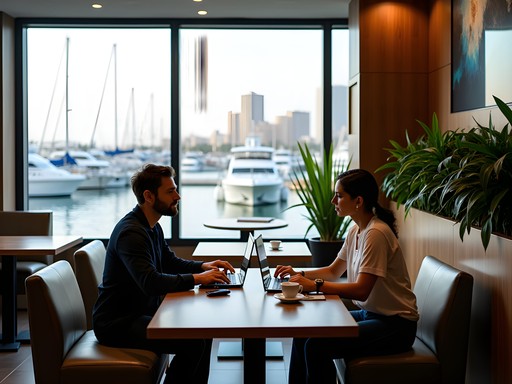 Business professional working at Niche Café in Al Mouj Marina with laptop and coffee