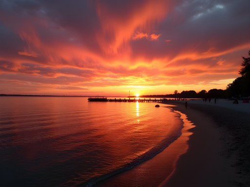 Dramatic sunset over Lake Ontario with silhouette of Rochester pier in foreground