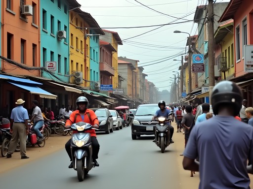 Busy street scene in downtown Kinshasa with pedestrians and traffic