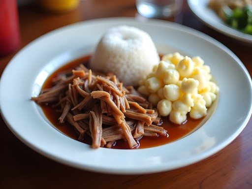 Traditional Hawaiian plate lunch with kalua pork, rice, and mac salad from local Mililani restaurant