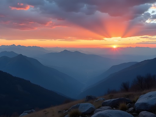 Panoramic sunset view from Lost Gulch Overlook showing layered mountain silhouettes