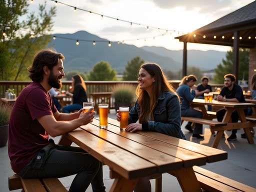 Outdoor brewery patio in Fort Collins with mountain views and hikers enjoying craft beer