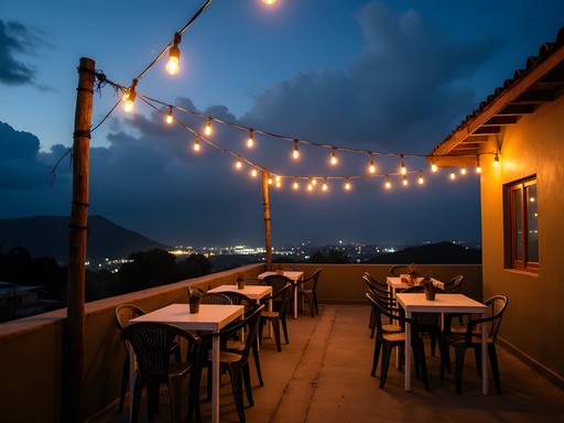 Rooftop bar in Antsirabe with string lights and views of the highland city at night
