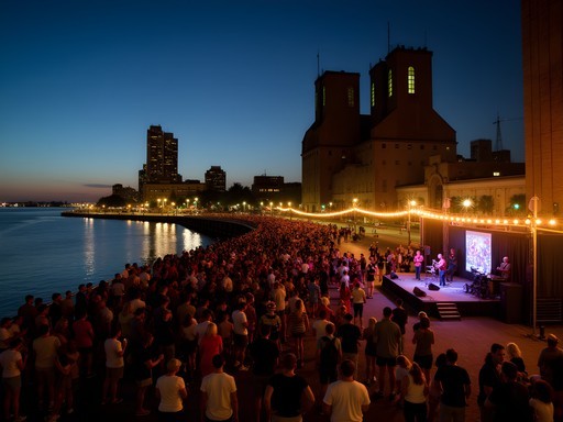 Evening concert at Buffalo's Canalside waterfront with illuminated grain silos