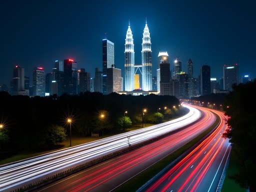 Long exposure photograph of light trails on Kuala Lumpur highway with illuminated skyline