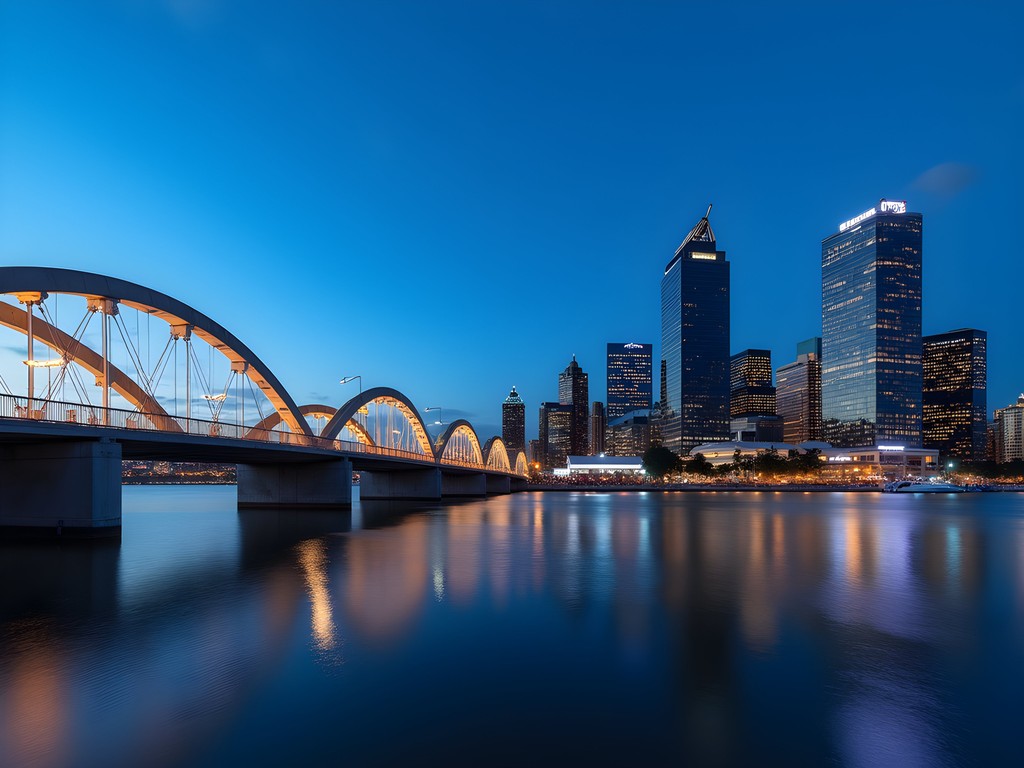 Elizabeth Quay pedestrian bridge illuminated during blue hour with Perth skyline