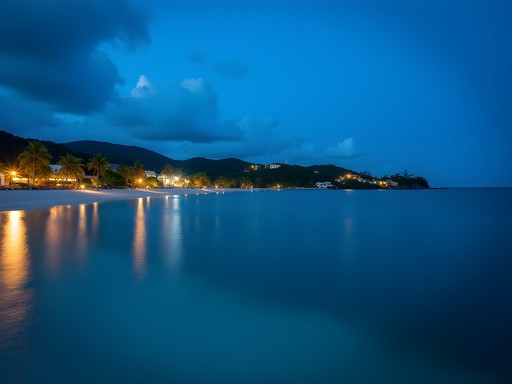 Long exposure photograph of Dickenson Bay at blue hour with resort lights