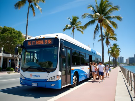 Sunbus public transport along Cairns Esplanade with families boarding