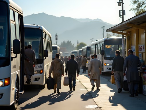 Busy Quetta bus terminal with travelers boarding intercity coaches