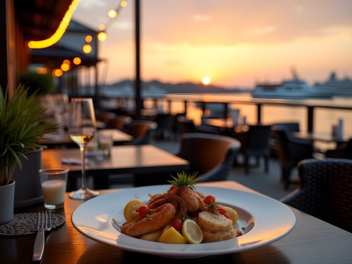 Waterfront dining in Portsmouth with view of harbor and naval ships at sunset