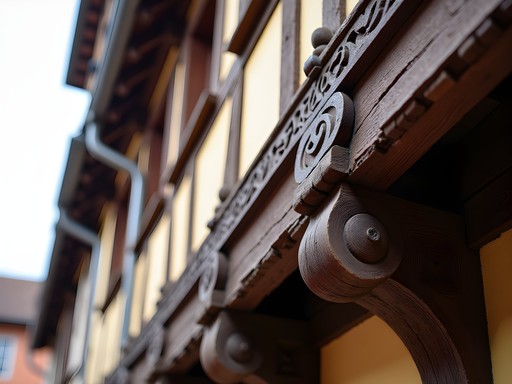 Close-up of ornate wooden beam carvings on medieval buildings in Petite France
